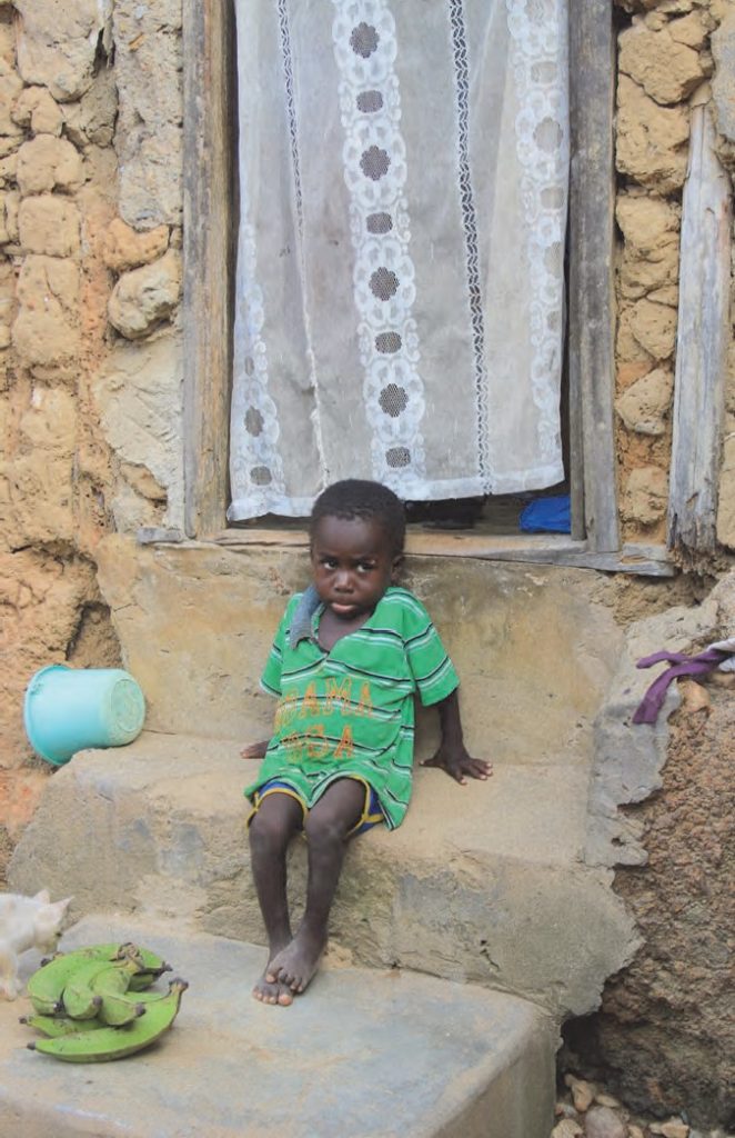 "Ghanaian Boy and His Home" photograph